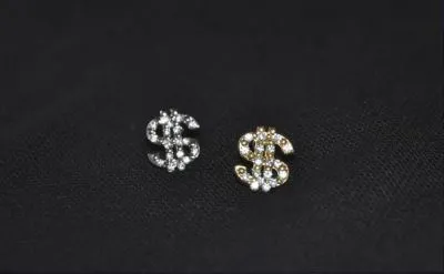 Studs pour oreille pour homme en Dollar avec diamants incrusté